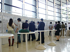 Attendees closely examine the panel exhibition of the Faculty of Science & Engineering 
